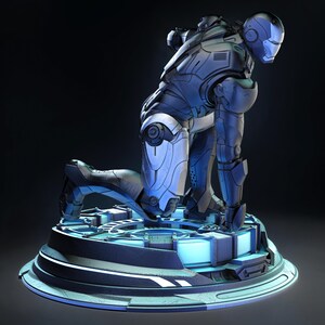 May include: A detailed, blue and silver Iron Man action figure in a kneeling pose. The figure is on a circular, futuristic-looking base with glowing blue accents. The armor has intricate paneling and a helmet with a distinctive faceplate.