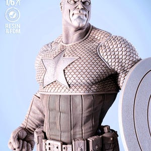 May include: A detailed statue of Captain America, featuring a star on the chest and a shield. The figure is in a neutral color, with textured armor and a utility belt. The scale is 1/6.