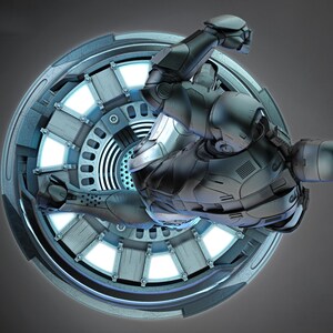 May include: A futuristic, silver-colored armored figure is positioned within a circular, metallic structure. The structure has a radial design with glowing blue lights. The figure is in a dynamic pose, suggesting movement or action, against a gray background.