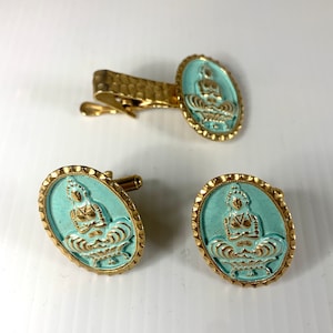 Vintage 3pc goldtone Buddha cufflinks and tie clip set, mid century cufflinks