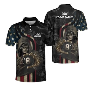 May include: Black polo shirt featuring a grim reaper holding an eight ball. The shirt has an American flag design on the sleeves and a skull graphic. The text "YOUR NAME" and "TEAM NAME" are visible.