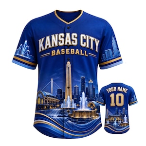 May include: A royal blue baseball jersey featuring a button-down front, gold and white text reading KANSAS CITY BASEBALL, and a graphic print of a city skyline with fountains. The back displays the text YOUR NAME and the number 10 in gold.