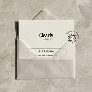 May include: A white 5x7 invitation card in a translucent envelope. The card features the text "Clearly Mockups" and "5 x 7 Invitation". A small sun graphic with "Translucent Envelope" is on the envelope.