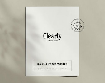 May include: A white 8.5 x 11 inch paper mockup with the text "Clearly MOCKUPS". The mockup includes the text "8.5 x 11 Paper Mockup" and "INTENTIONAL TOOLS FOR MAKERS & ARTISTS". A small graphic with the text "TURN SHADOW ON/OFF CHANGE BACKGROUND COLOR" is also present.