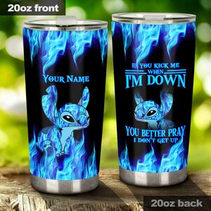 May include: Two 20oz stainless steel tumblers with a blue flame design and a cartoon character. One tumbler says "YOUR NAME" and features the character. The other says "IF YOU KICK ME WHEN I'M DOWN YOU BETTER PRAY I DON'T GET UP."
