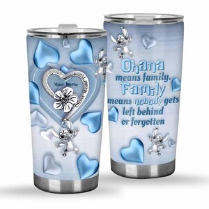 May include: A stainless steel tumbler with a light blue gradient background, featuring a heart-shaped design with a flower and the text "Your Name". The tumbler also has blue hearts and a cartoon character, with the text "Ohana means family."