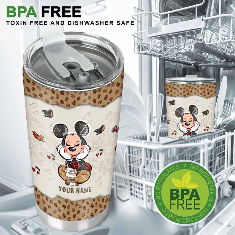 May include: Stainless steel travel mug featuring a cartoon mouse character with a coffee cup. The mug has a white background with a coffee bean design and the text "YOUR NAME". The mug is BPA free, toxin free, and dishwasher safe.