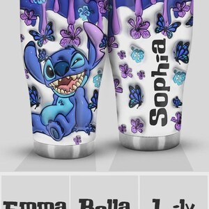 May include: A stainless steel tumbler featuring a cartoon character, Stitch, surrounded by butterflies and flowers in shades of blue, purple, and white. The tumbler has a personalized name, "Sophia", printed vertically on the side.