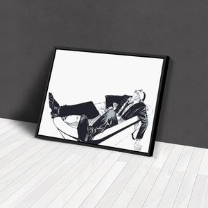 May include: Black and white framed art print depicting a person reclining in a chair. The person is wearing a suit and tie. The artwork is a stylized illustration with a minimalist aesthetic.