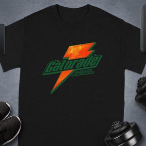 Gatorade-logotyp T-shirt, tröja, hoodie, törstsläckare, populär sportdryck, sportkläder, unisexkläder, trendig design, gatukläder