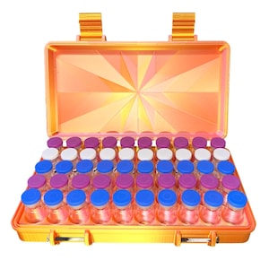 May include: An open orange carrying case filled with small glass bottles. The bottles have blue, white, and purple lids. The case has a geometric design on the inside and a handle on top.