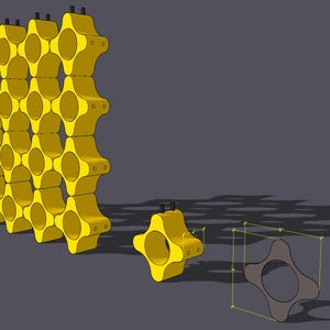 Può includere: Struttura modulare gialla con design a nido d'ape, forse per scaffalature o espositori. L'immagine mostra più unità collegate, insieme a una singola unità staccata e un modello wireframe.