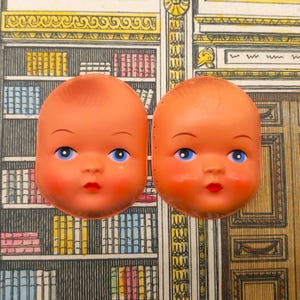 2 vintage poppengezichten