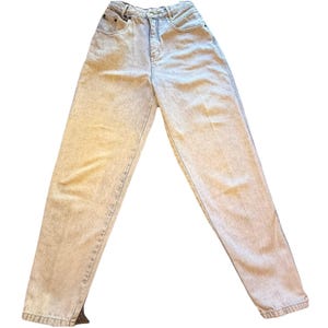 May include: Light wash denim jeans with a high waist and a relaxed fit. The jeans have a classic five-pocket design, a button and zipper closure, and belt loops. The denim has a faded, acid-wash appearance.