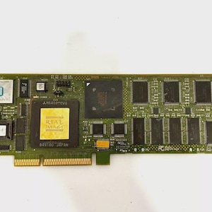May include: A green Compaq circuit board with various electronic components, including chips, connectors, and a gold-colored Real Image label. The board has a rectangular shape and is designed for computer hardware.