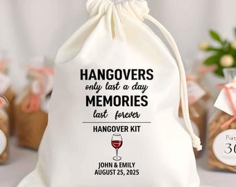 May include: A white drawstring bag with the text "HANGOVERS only last a day, MEMORIES last forever, HANGOVER KIT." A red wine glass graphic is below the text. The names "JOHN & EMILY" and the date "AUGUST 25, 2025" are printed below the graphic.