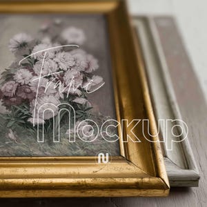 May include: Close-up of two picture frames, one gold and one white. The gold frame has a floral print inside with the word "Frame Mockup" overlaid. The white frame is out of focus. The gold frame is in the foreground.