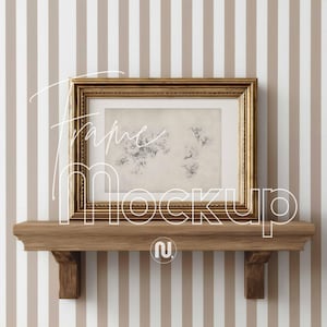 May include: A gold-framed picture with a floral print rests on a wooden shelf. The frame has ornate detailing and the print features delicate botanical illustrations. The background is a striped pattern in beige and white. The text "Frame Mockup" is overlaid on the image.