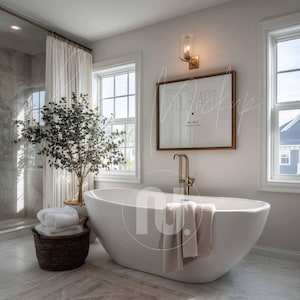 May include: A modern bathroom with a white oval bathtub, a framed artwork, and a bronze faucet. A woven basket holds folded white towels, and a plant adds a touch of greenery. The room has large windows and a neutral color palette.