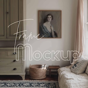 May include: A room interior with a framed portrait, a woven basket, and a small wooden table. The text "Frame Mockup" is overlaid on the image. The portrait features a woman in a blue shawl. The room has a neutral color palette.