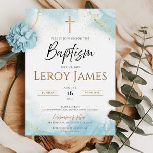 May include: Baptism invitation with a light blue watercolor background and gold accents. The invitation includes the text "Baptism of our son Leroy James" and event details. A blue flower and greenery are in the image.
