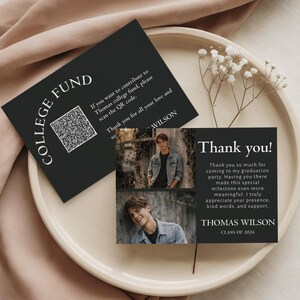 May include: Black graduation thank you cards with photos and text. One card says "College Fund" with a QR code. The other card says "Thank you!" with a photo and text. The graduate's name is Thomas Wilson.