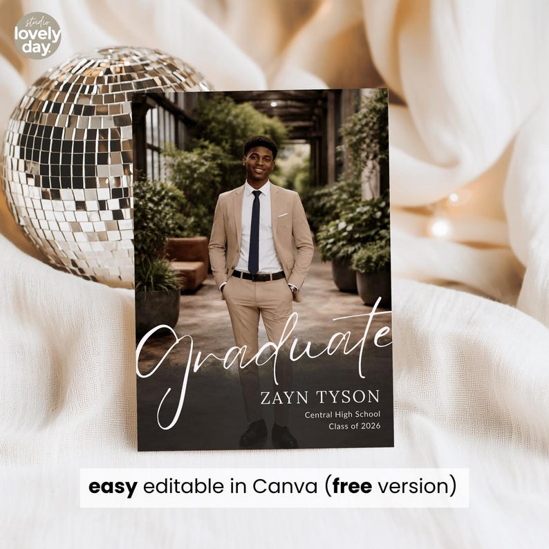 May include: A graduation announcement featuring a photo of a graduate in a tan suit, with the word "Graduate" in elegant script. The announcement includes the graduate's name, school, and class year. The text "easy editable in Canva (free version)" is also included.