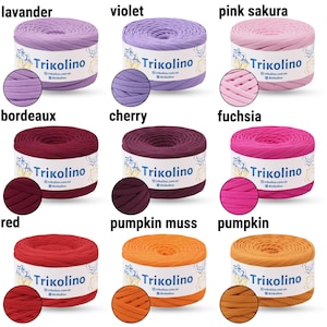 May include: Nine spools of Trikolino yarn in various colors, including lavender, violet, pink sakura, bordeaux, cherry, fuchsia, red, pumpkin muss, and pumpkin. Each spool is labeled with the brand name.