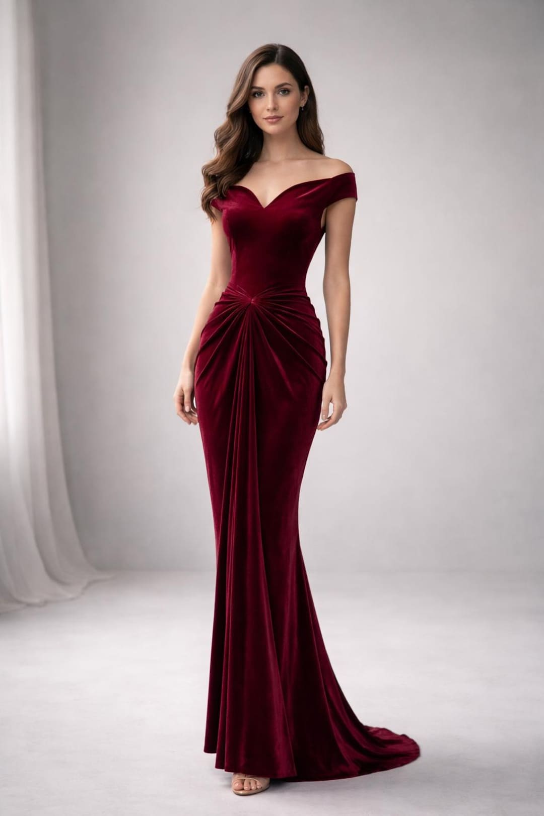 Woman wearing a burgundy velvet gown as a winter wedding guest