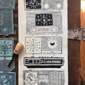 May include: A black and white illustration of a collection of vintage clocks and radios. The clocks and radios are arranged vertically, with the oldest at the top and the newest at the bottom. The illustration is on a white background.