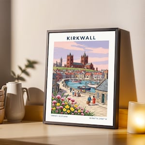May include: Framed art print of Kirkwall, Orkney, Scotland, featuring a colorful illustration of a coastal town with a cathedral, boats, and people. The print has a black frame and includes the text "KIRKWALL".