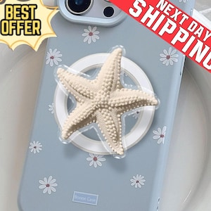 May include: A light blue phone case with a white starfish phone grip. The case has a daisy pattern and the text "Bonne Case". A "Best Offer" sticker is in the upper left corner.