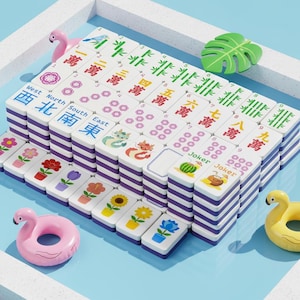 May include: A colorful Mahjong set with white tiles and purple edges. The tiles feature Chinese characters, numbers, and various symbols. Decorative flamingo and leaf accents are placed around the set, creating a playful aesthetic.