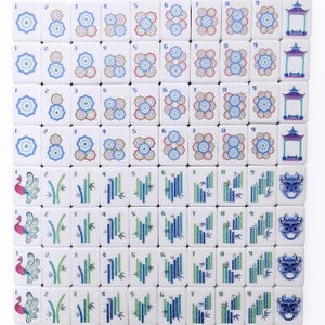 May include: A full set of white Mahjong tiles, each with distinct symbols and numbers. The tiles feature floral, bamboo, and dragon designs in blue, green, and red. Numbers 1-9 are displayed on the tiles.