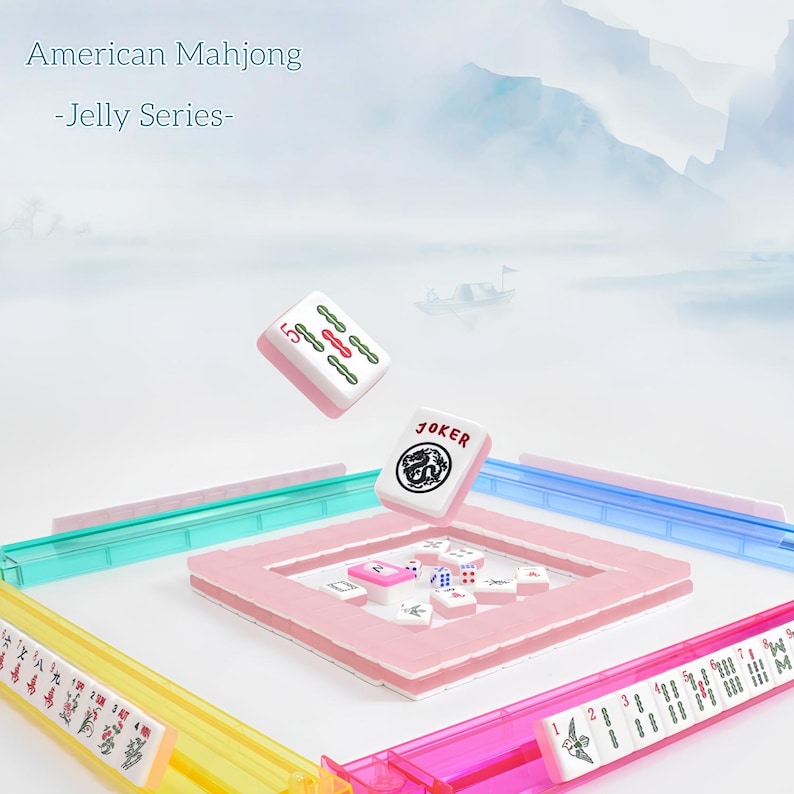 May include: American Mahjong Jelly Series set featuring translucent colorful racks in yellow, pink, blue, and green. A white tile with a red 5 and green symbols, and a white Joker tile with a black dragon graphic are suspended above the game board.