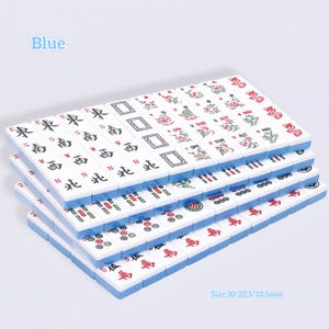 May include: A set of rectangular mahjong tiles with blue backs, featuring various engraved symbols, Chinese characters, and floral designs in red, green, and black. The tiles are stacked in rows, and the text Size:30*22.5*12.5mm is printed on the image.