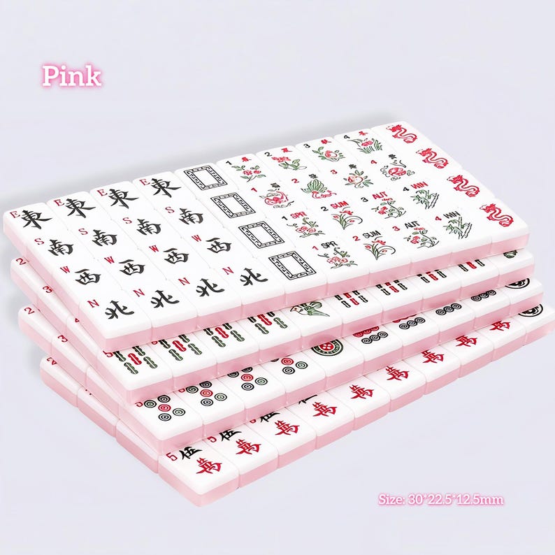 May include: A set of white mahjong tiles with pink backs, featuring various black, red, and green engraved symbols, characters, and floral designs. The tiles are arranged in stacked rows. Text on the image includes Pink and Size: 30*22.5*12.5mm.