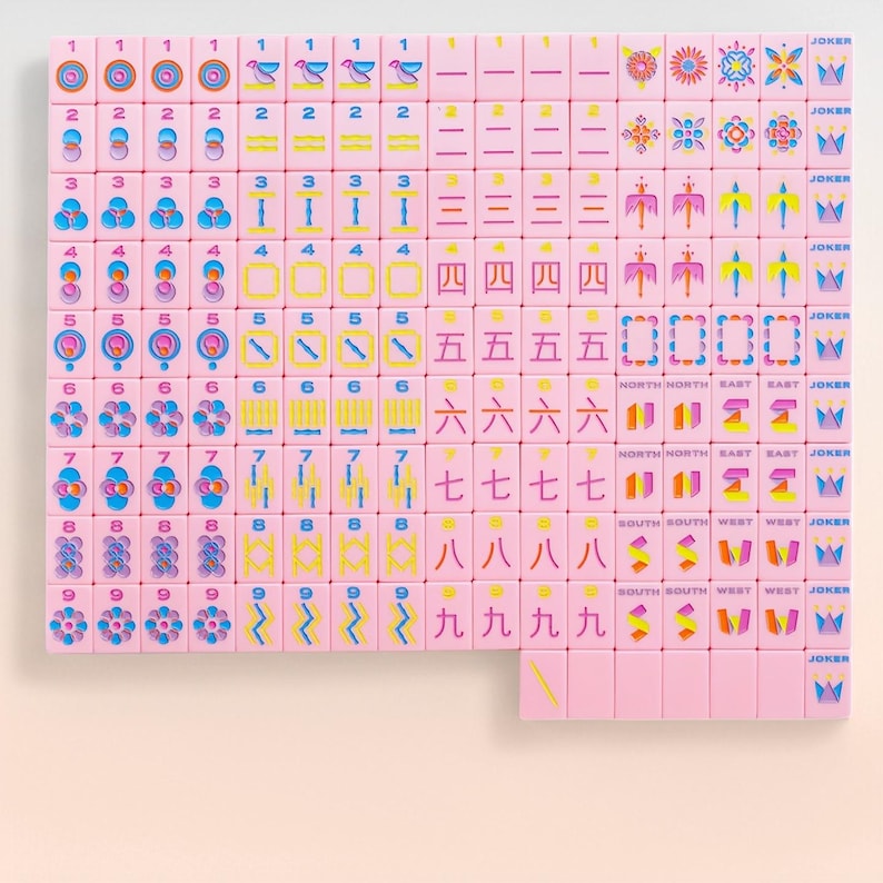 May include: A set of pink mahjong tiles arranged in a grid, featuring colorful engraved numbers, symbols, directional markers, and joker tiles with crown icons. Each tile displays distinct patterns in blue, yellow, and pink, organized by rank.