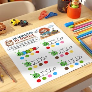 May include: A worksheet with the text "15 Minutes to School" featuring caterpillar illustrations and colorful dots. The image includes colored pencils, toy cars, and other school supplies on a wooden desk, ideal for early childhood education.