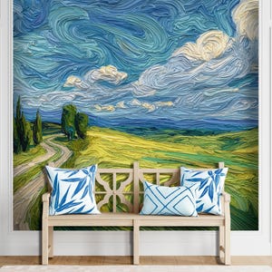 May include: A scenic wall mural depicting a landscape with a winding road, green fields, and a blue sky with swirling clouds. A wooden bench with three decorative pillows featuring blue leaf patterns is in front of the mural.