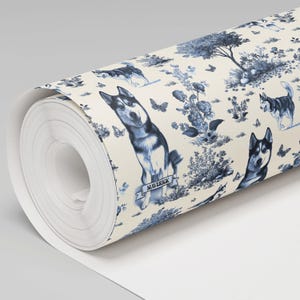 May include: A roll of wallpaper featuring a repeating pattern of blue and white Siberian huskies in a pastoral scene. The design includes trees, flowers, and butterflies. One husky has the name "Maverick" on a banner.