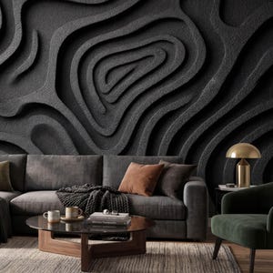 May include: A set of three ceramic mugs with a speckled, matte finish. The mugs are in shades of cream, light gray, and dark gray. Each mug has a simple, minimalist design, perfect for coffee or tea.