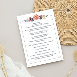 May include: A white card with a floral design at the top and text that reads "We are beloved spirit daughters of God and our lives have meaning, purpose, and direction. As a worldwide sisterhood, we are united in our devotion to Jesus Christ, our Savior and Exemplar. Increase our testimonies of Jesus Christ through prayer and scripture study. Seek spiritual strength by following the promptings of the Holy Ghost. Dedicate ourselves to strengthening marriages, families, and homes. Find nobility in motherhood and joy in womanhood. Delight in service and good works. Love life and learning. Stand for truth and righteousness. Sustain the priesthood as the authority of God on Earth. Rejoice in the blessings of the temple, understand our divine destiny, and strive for exaltation."