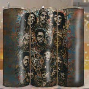 May include: A stainless steel tumbler featuring a collage of portraits of iconic figures. The design includes portraits of musicians and revolutionaries, set against a backdrop of graffiti-style art. The tumbler has a straw and a lid.