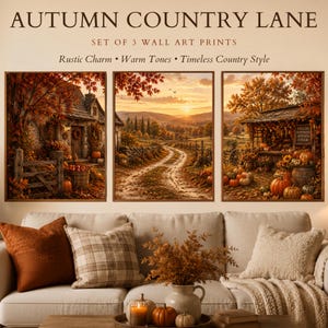 May include: A set of three wall art prints titled AUTUMN COUNTRY LANE, SET OF 3 WALL ART PRINTS, Rustic Charm, Warm Tones, Timeless Country Style. The prints depict a stone cottage, a winding dirt road at sunset, and a pumpkin stand.