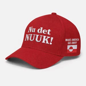 May include: A red baseball cap with white embroidered text that reads "Nu det NUUK!" on the front. The phrase "MAKE AMERICA GO AWAY" is printed on the side, along with a flag.