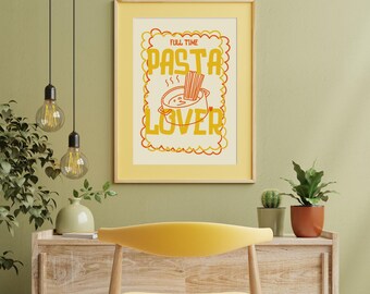May include: A framed poster with the words "FULL TIME PASTA LOVER" in orange and yellow. The poster features a graphic of a pot of pasta with steam rising. The frame is a light yellow colour.