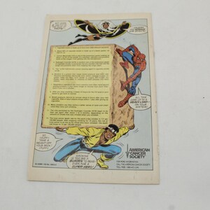 May include: Comic book page featuring Marvel superheroes Spider-Man, Storm, and Luke Cage. The page includes text about the American Cancer Society and the dangers of smoking. The comic is on a white background.