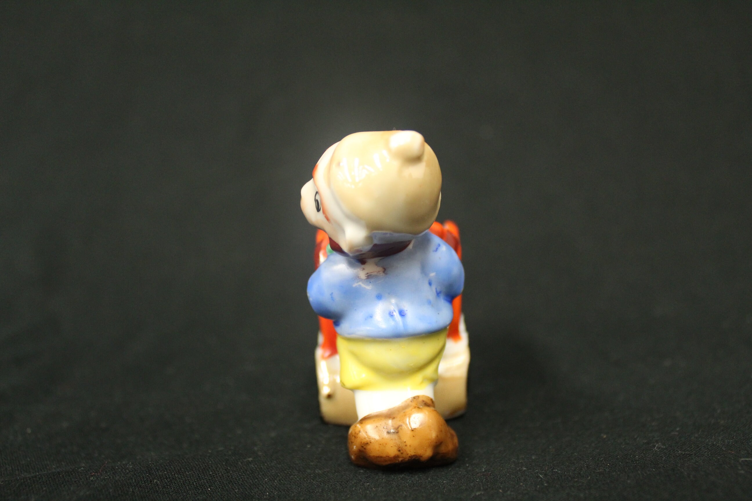 Vintage Smiling Dwarf Miner Man Japan Ceramic Boy Pushing Orange