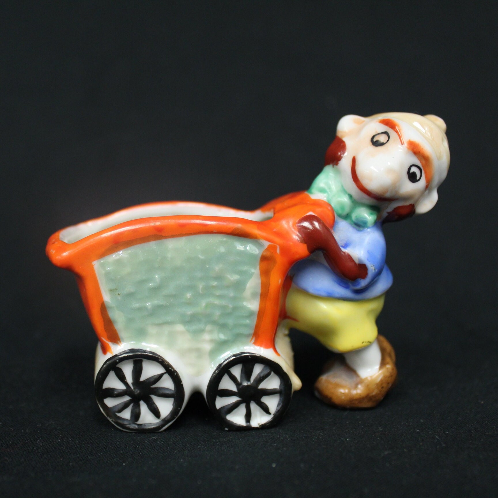 Vintage Smiling Dwarf Miner Man Japan Ceramic Boy Pushing Orange
